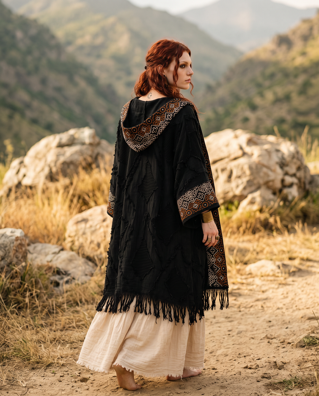 Close up portrait of model wearing boho kimono with beaded necklace