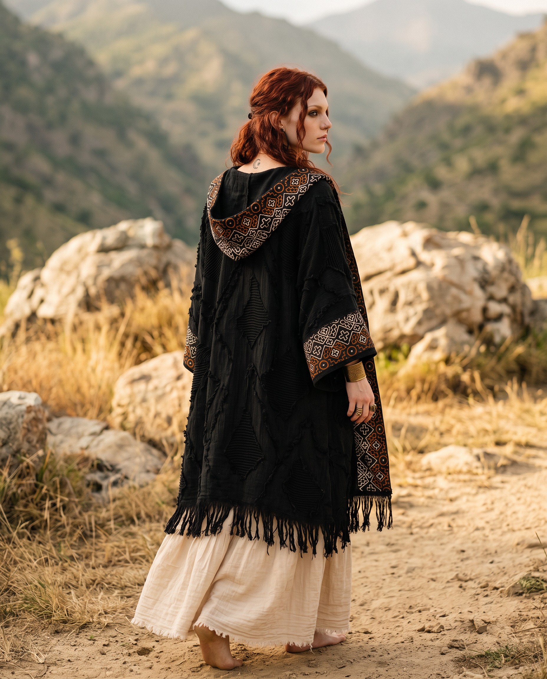 Close up portrait of model wearing boho kimono with beaded necklace